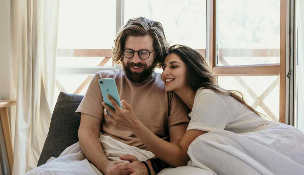 cute couple in bed cuddling