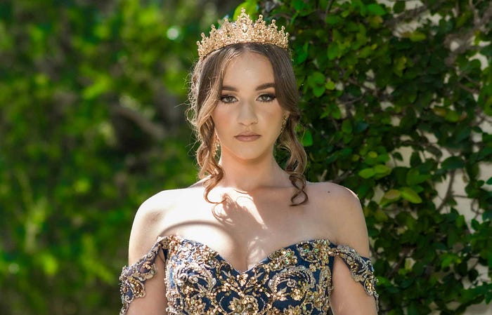 Woman in crown, treated like royalty