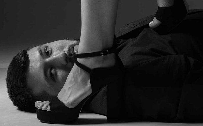 Man stepped on by woman